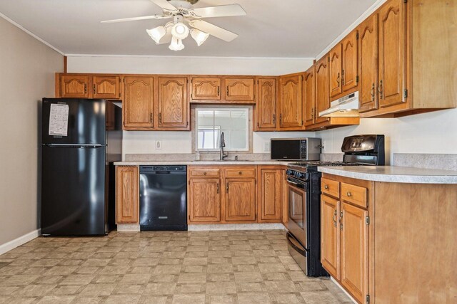 27 Arlington Dr, Romeoville, IL 60446 - kitchen featuring black appliances, a sink, under cabinet range hood, brown cabinets, and crown molding