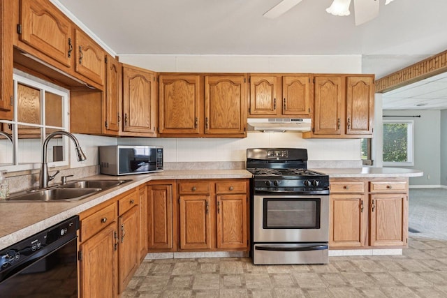 27 Arlington Dr, Romeoville, IL 60446 - kitchen featuring appliances with stainless steel finishes, under cabinet range hood, a sink, and light countertops