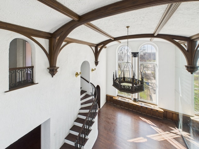 5555 S Everett Ave Unit B3-4, Chicago, IL 60637 - dining space with an inviting chandelier, wood finished floors, a textured ceiling, stairway, and arched walkways