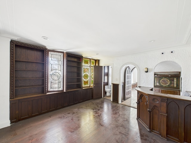 5555 S Everett Ave Unit B3-4, Chicago, IL 60637 - unfurnished living room featuring built in shelves, crown molding, and dark wood-type flooring
