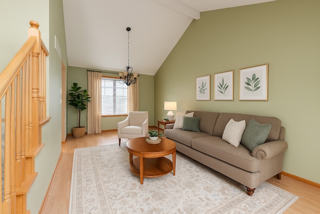1678 Eagles Lndg N, Manteno, IL 60950 - living area featuring wood finished floors, a chandelier, beamed ceiling, high vaulted ceiling, and baseboards