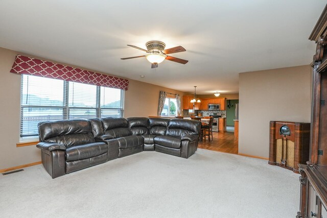 1678 Eagles Lndg N, Manteno, IL 60950 - carpeted living area with ceiling fan and baseboards