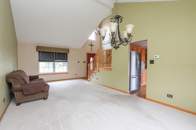 1678 Eagles Lndg N, Manteno, IL 60950 - unfurnished room featuring high vaulted ceiling, stairway, carpet flooring, a chandelier, and baseboards