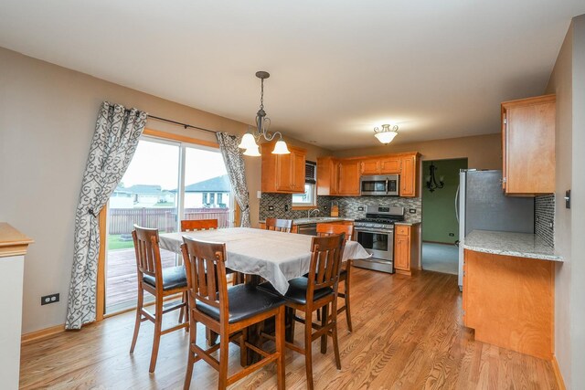 1678 Eagles Lndg N, Manteno, IL 60950 - dining space with light wood-style floors and baseboards