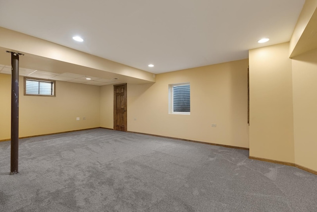 basement with baseboards, recessed lighting, and carpet