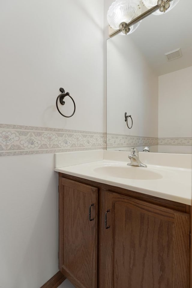 bathroom with visible vents and vanity