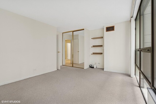 230 E Ontario St Unit 1205, Chicago, IL 60611 - unfurnished bedroom featuring light colored carpet and a closet