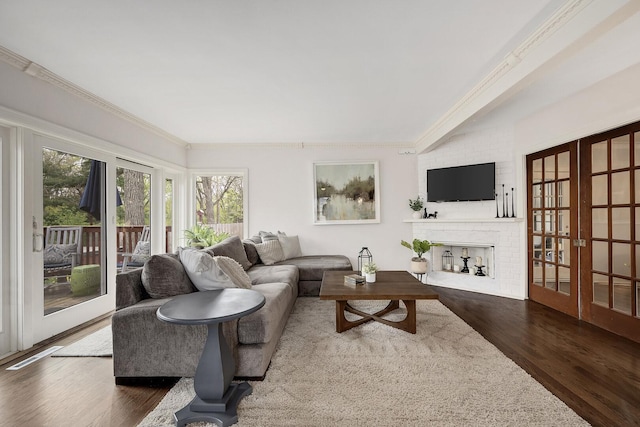 5619 Dunham Rd, Downers Grove, IL 60516 - living area with french doors, wood finished floors, ornamental molding, and a brick fireplace