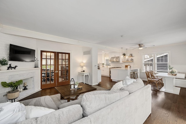5619 Dunham Rd, Downers Grove, IL 60516 - living area featuring french doors, a ceiling fan, dark wood-style flooring, ornamental molding, and baseboards