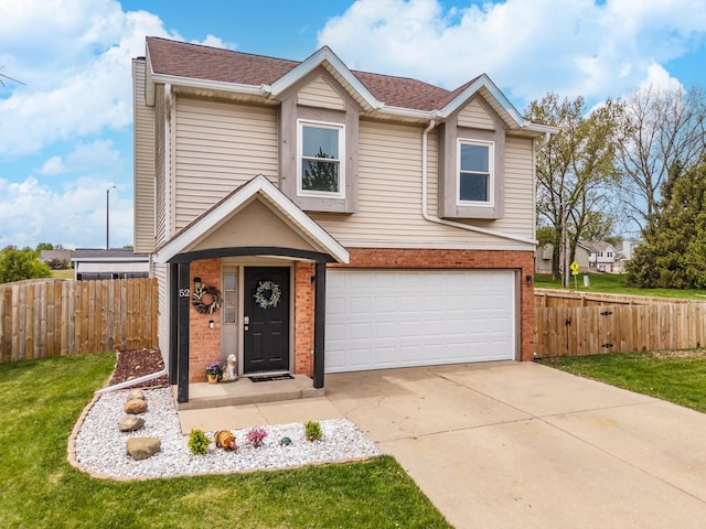 traditional-style home with a garage, fence, a front yard, brick siding, and driveway