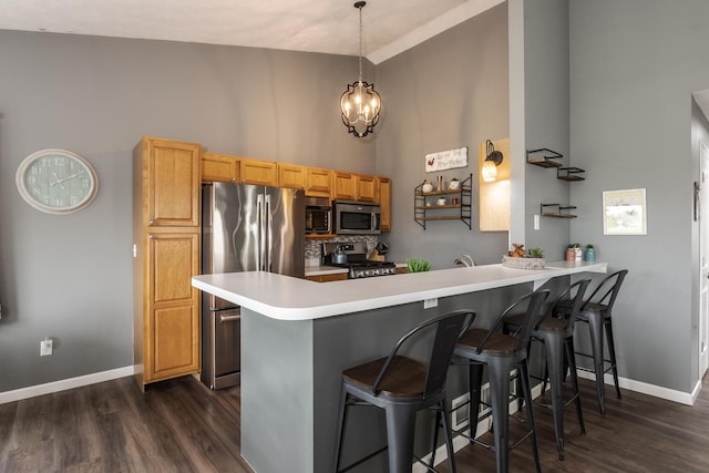 kitchen with baseboards, dark wood-style flooring, high vaulted ceiling, and stainless steel appliances