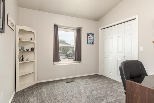 carpeted office space with baseboards and visible vents