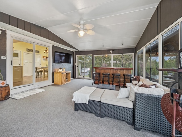 27241 W Nippersink Rd, Ingleside, IL 60041 - carpeted living room with a ceiling fan, vaulted ceiling, and wood walls