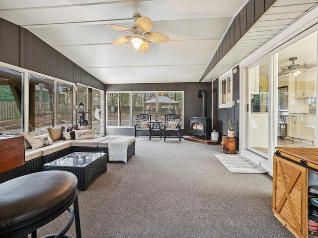 27241 W Nippersink Rd, Ingleside, IL 60041 - sunroom with ceiling fan, outdoor lounge area, and a wood stove