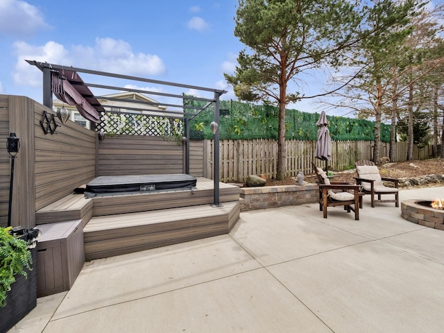 27241 W Nippersink Rd, Ingleside, IL 60041 - view of patio / terrace with a fenced backyard, an outdoor fire pit, and a covered hot tub