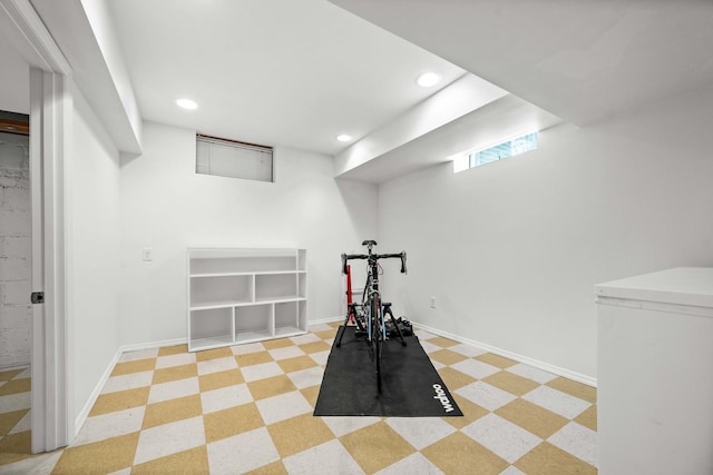 workout room featuring light floors, baseboards, and recessed lighting