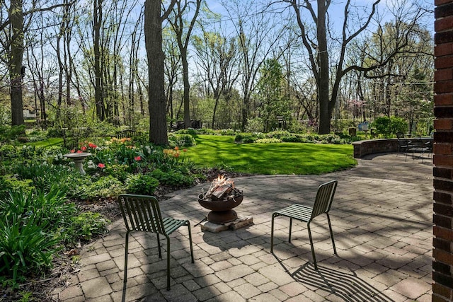 view of patio with an outdoor fire pit