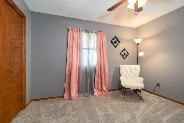 1107 N Bailey Dr, Pontiac, IL 61764 - living area with carpet floors, a ceiling fan, and baseboards