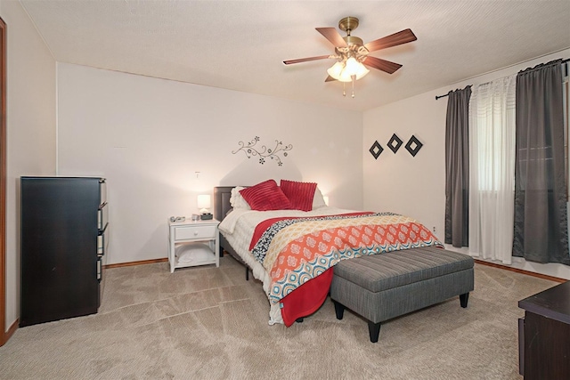1107 N Bailey Dr, Pontiac, IL 61764 - carpeted bedroom featuring a ceiling fan and baseboards