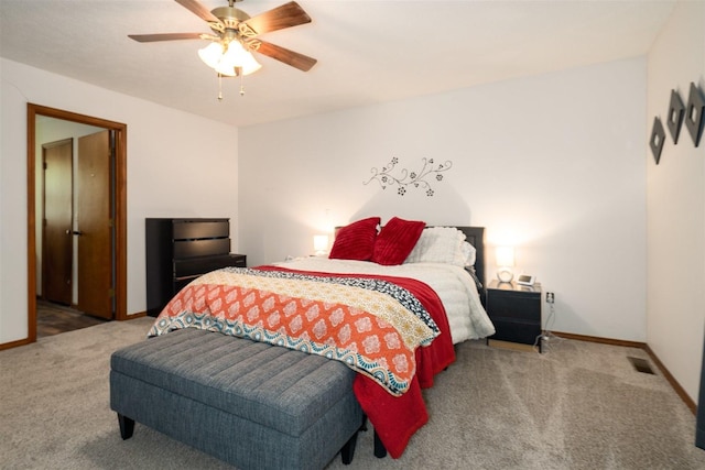 1107 N Bailey Dr, Pontiac, IL 61764 - carpeted bedroom with baseboards and ceiling fan