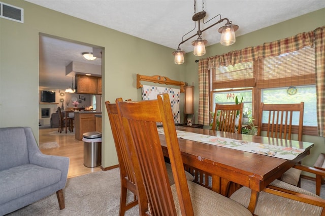 1107 N Bailey Dr, Pontiac, IL 61764 - dining space with light carpet