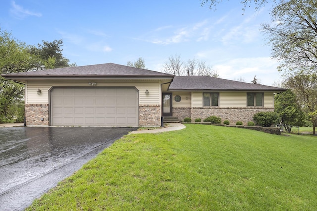 ranch-style house with brick siding, a garage, a front lawn, and aphalt driveway