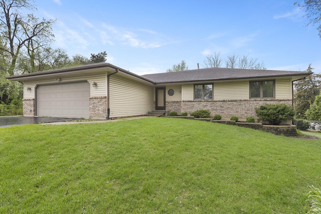 single story home with brick siding, driveway, a front yard, and a garage