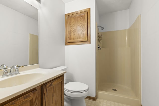 full bath featuring vanity, toilet, and a shower