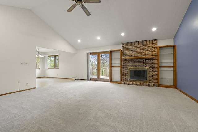 unfurnished living room with carpet floors, a fireplace, baseboards, recessed lighting, and ceiling fan with notable chandelier