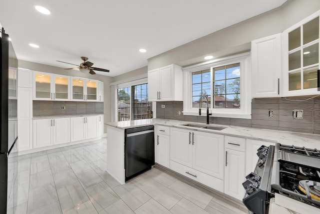 4424 Maple Ave, Brookfield, IL 60513 - kitchen featuring light stone counters, dishwasher, stainless steel range with gas stovetop, a sink, and backsplash