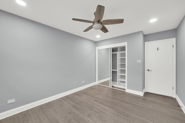4424 Maple Ave, Brookfield, IL 60513 - unfurnished bedroom with a ceiling fan, wood finished floors, baseboards, a closet, and recessed lighting