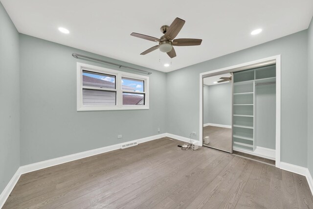 4424 Maple Ave, Brookfield, IL 60513 - unfurnished bedroom with visible vents, a closet, wood finished floors, baseboards, and a ceiling fan