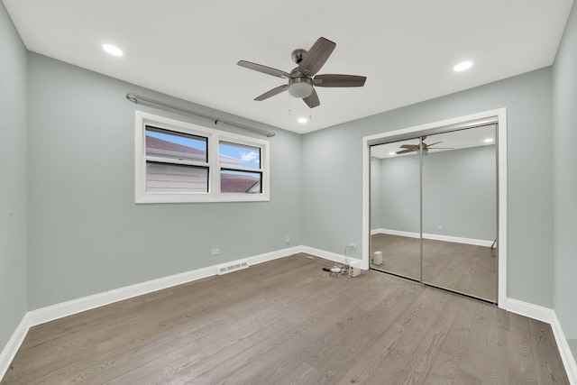 4424 Maple Ave, Brookfield, IL 60513 - unfurnished bedroom featuring recessed lighting, baseboards, wood finished floors, visible vents, and a closet