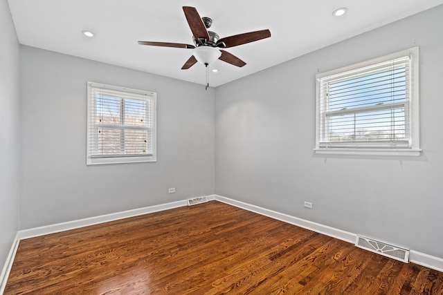 spare room featuring visible vents and baseboards