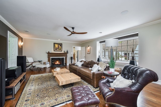36W722 Crane Rd, Saint Charles, IL 60175 - living area with dark wood-style flooring, ornamental molding, a warm lit fireplace, and a ceiling fan