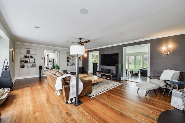 36W722 Crane Rd, Saint Charles, IL 60175 - living area with ceiling fan, wood-type flooring, built in features, crown molding, and arched walkways