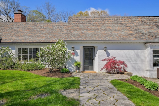 36W722 Crane Rd, Saint Charles, IL 60175 - entrance to property with brick siding, roof with shingles, and a chimney