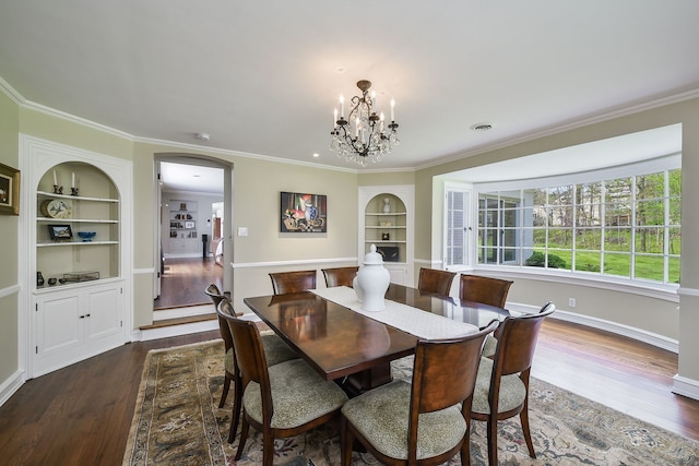36W722 Crane Rd, Saint Charles, IL 60175 - dining space with arched walkways, a chandelier, dark wood-style floors, and built in shelves