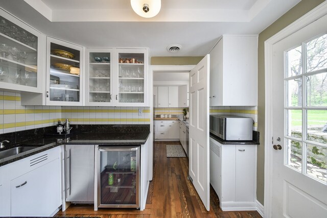 36W722 Crane Rd, Saint Charles, IL 60175 - kitchen with white cabinetry, decorative backsplash, dark wood-style floors, and beverage cooler