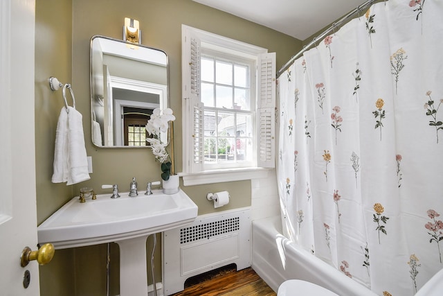 36W722 Crane Rd, Saint Charles, IL 60175 - bathroom featuring shower / bath combo with shower curtain, wood finished floors, and radiator heating unit