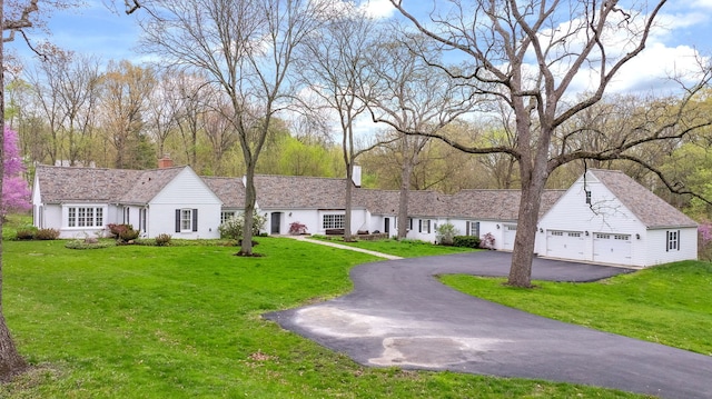 36W722 Crane Rd, Saint Charles, IL 60175 - ranch-style home with a front lawn, driveway, and a chimney