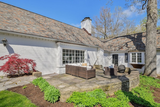 36W722 Crane Rd, Saint Charles, IL 60175 - rear view of house featuring an outdoor living space, a chimney, brick siding, a patio, and a high end roof
