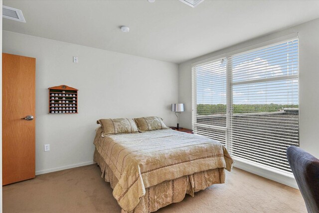 carpeted bedroom with baseboards