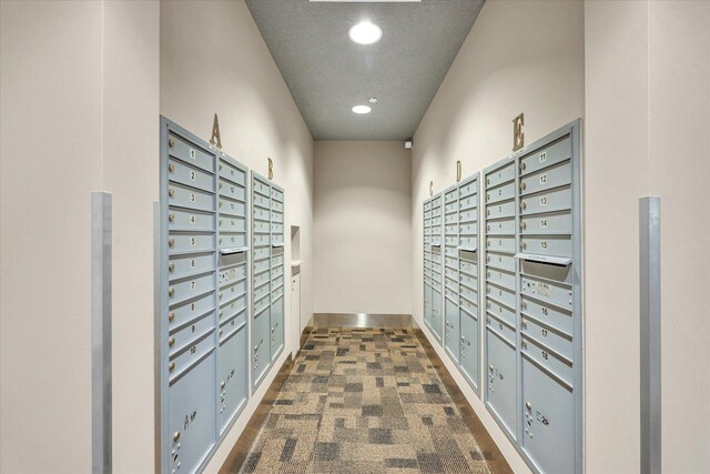 view of property's community with mail area and recessed lighting
