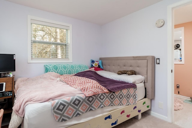 bedroom with baseboards and carpet flooring