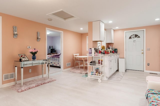 kitchen with white cabinetry, visible vents, recessed lighting, and light wood finished floors