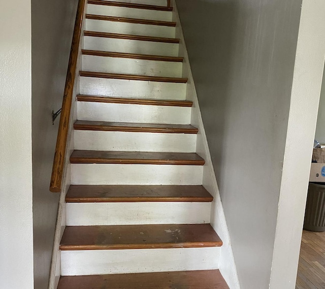stairs with wood finished floors