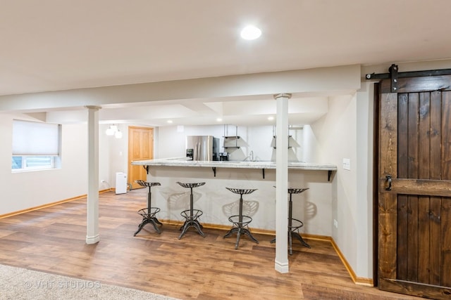 685 Veronica Ct, New Lenox, IL 60451 - kitchen featuring a kitchen bar, stainless steel fridge with ice dispenser, a peninsula, baseboards, and recessed lighting