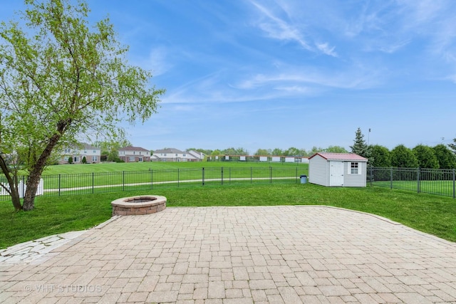 685 Veronica Ct, New Lenox, IL 60451 - view of patio featuring an outdoor fire pit, an outbuilding, and a shed