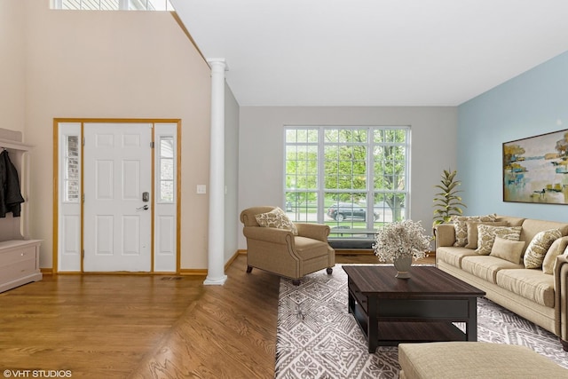 685 Veronica Ct, New Lenox, IL 60451 - living area featuring wood finished floors, baseboards, and decorative columns